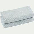 COLINE - Lot de 2 serviettes invités en bouclettes de coton bio - bleu 30x50cm
